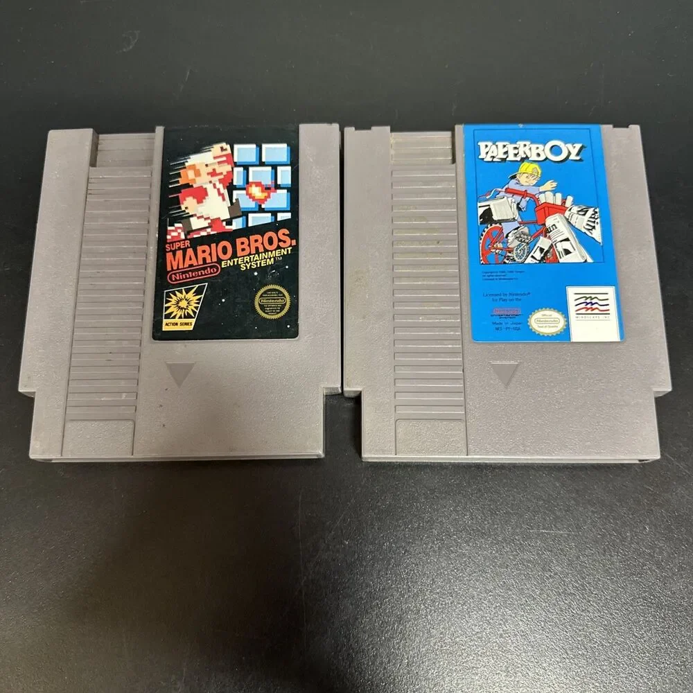 NES PAPERBOY TOY VIDEO GAME AND  SUPER MARIO BROS CARTRIDGE.